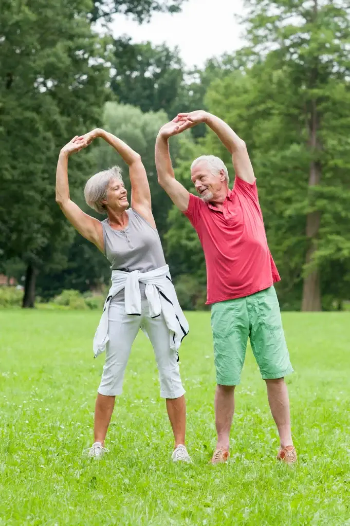 a man and woman doing stretching exercises
